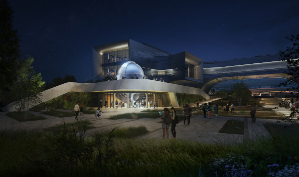 Night view of a modern building with a dome and people walking in the outdoor space.